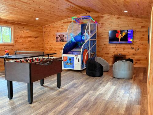 a room with a play room with a game table at Site R Full Hookup up to 38ft Site ONLY in Gaines