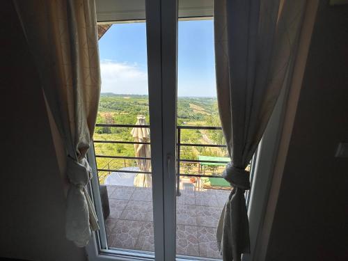 an open window with a view of the countryside at Villa Popovic - apartments Fruska gora in Sremski Karlovci