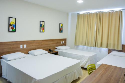 Ένα ή περισσότερα κρεβάτια σε δωμάτιο στο Mac Hotel