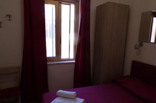 Postel nebo postele na pokoji v ubytování NUOVA AURORA Rent Rooms