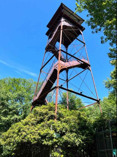 a wooden tower on top of a tree at Water and Electric 30 Amp Pull through up to 24 Site ONLY in Gaines