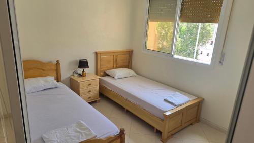 Postel nebo postele na pokoji v ubytování Nekor Bay Villa