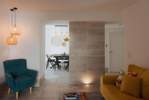 a living room with a couch and a table at Casa do Outeiro com vista para o Castelo de Marvão in Marvão