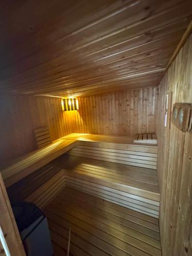 a wooden sauna with a light on top of it at Božič Residence in Vipava