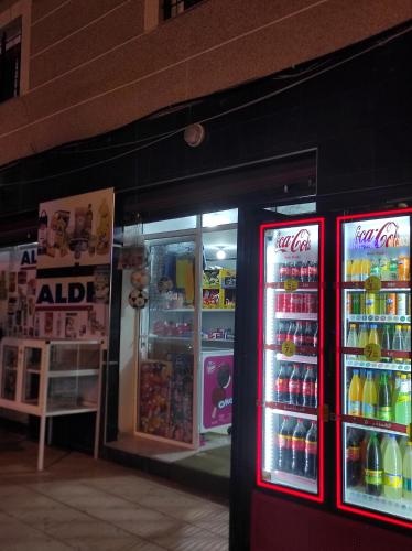 a store with two refrigerators with soda and other drinks at La Jolie Al Jadid in Nador