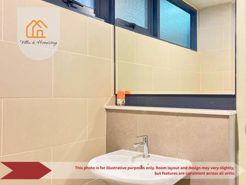 a bathroom with a sink and a mirror at The Executive Lofts - Cyber City Suites in Cyberjaya