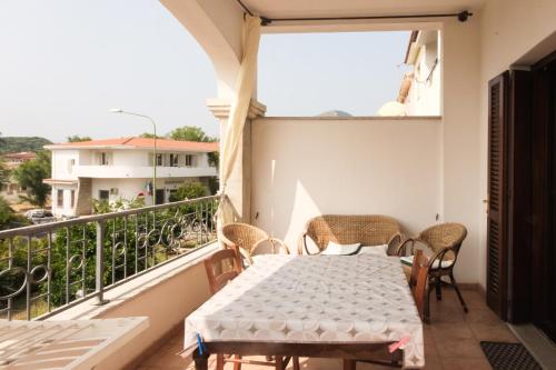 a balcony with a table and chairs and a view at Casa Cristallina in Posada