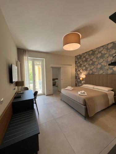 Postel nebo postele na pokoji v ubytování Annunziatella Suite & Rooms