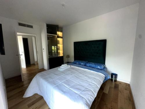 a bedroom with a large bed in a room at Sea View 1B Apartment, Théoule in Théoule-sur-Mer