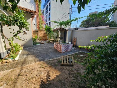 a courtyard in a house with a building at Lemon House in Tirana