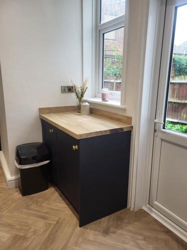 a desk in a room with a window at Relaxing Seaside Stay 3-Bed Home Minutes from Hythe Beach in Hythe