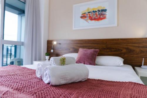 En eller flere senge i et værelse på V1307 Flat com vista para a Esplanada