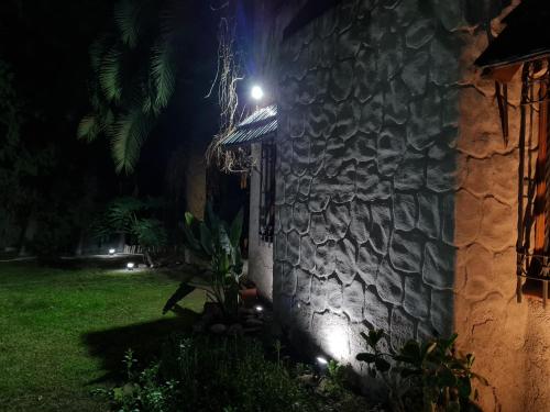 a stone building with a light on it at night at La casa de Ailun - Ideal vacaciones in Guaymallen