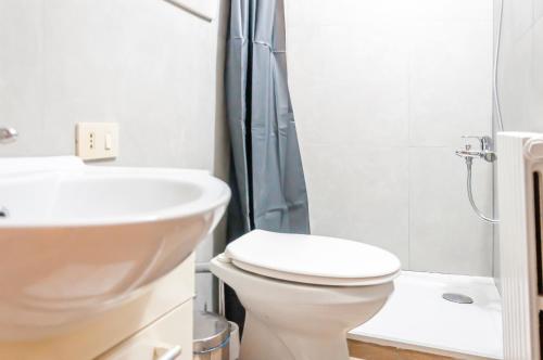 a bathroom with a toilet and a sink and a shower at room with private bathroom Stella 2 in Venice