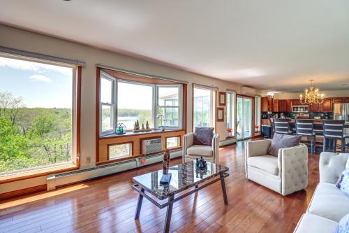 a living room with a couch and a table at Lake-View Gem with Game Room in Long Pond! in Long Pond