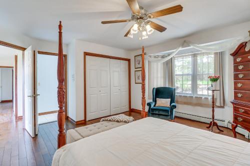 a bedroom with a bed and a ceiling fan at Lake-View Gem with Game Room in Long Pond! in Long Pond