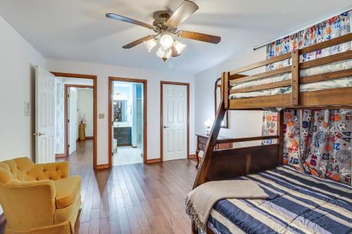 a bedroom with a bunk bed and a ceiling fan at Lake-View Gem with Game Room in Long Pond! in Long Pond