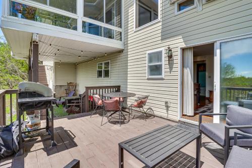a patio with a grill and a table and chairs at Lake-View Gem with Game Room in Long Pond! in Long Pond