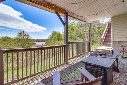 a porch with chairs and a table and a grill at Lake-View Gem with Game Room in Long Pond! in Long Pond