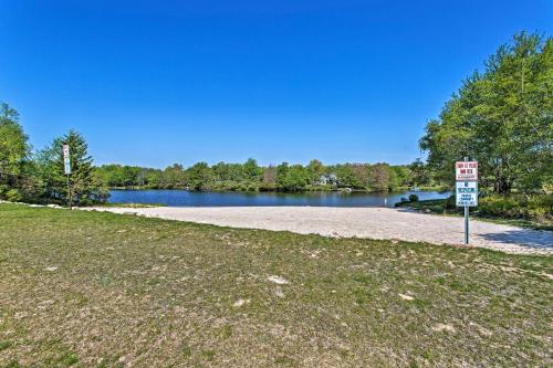 a no parking sign in front of a lake at Lake-View Gem with Game Room in Long Pond! in Long Pond