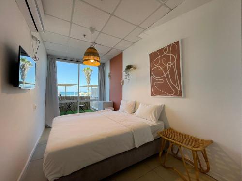 Postel nebo postele na pokoji v ubytování Central Beach Hotel