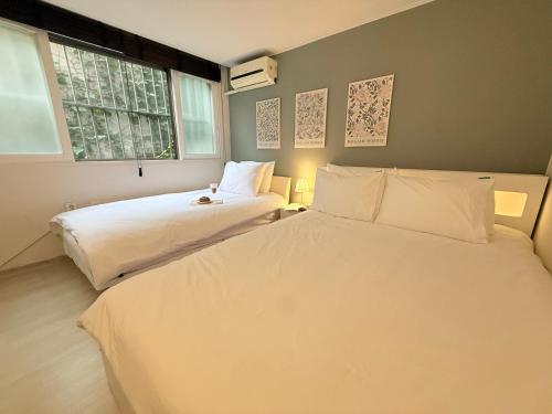 Ένα ή περισσότερα κρεβάτια σε δωμάτιο στο Solar House