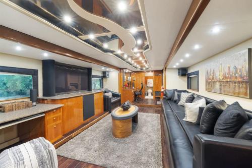 a living room with a couch and a television at 7744 Ranch Entire Resort in Austin