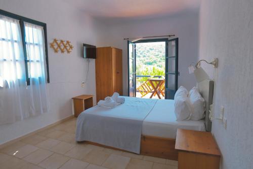 Ένα ή περισσότερα κρεβάτια σε δωμάτιο στο Agelos Studios