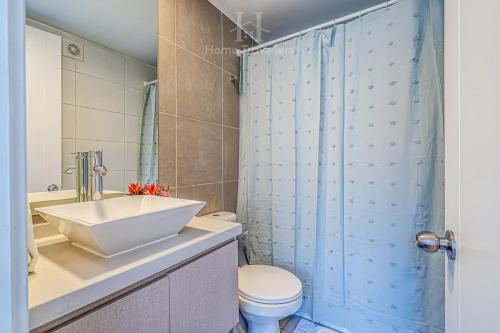 Un baño de HT Acogedor Dpto en Santiago con Wifi 3PAX