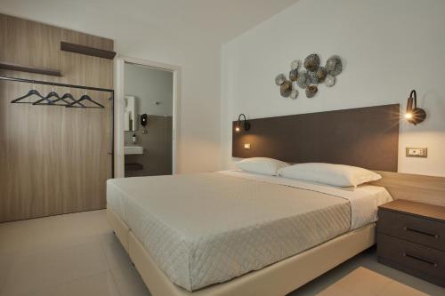 Postel nebo postele na pokoji v ubytování ARGHENTU Rooms