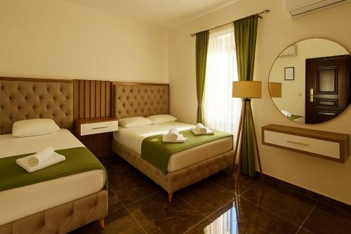 Postel nebo postele na pokoji v ubytování Apartmani Enydoo