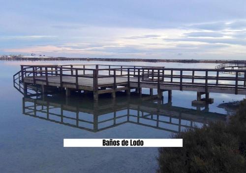 a dock in a body of water at Apartalux San Pedro Mar in San Pedro del Pinatar