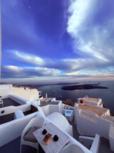 a view of the ocean from the balcony of a building at Sunset Caldera Seaview Houses in Imerovigli