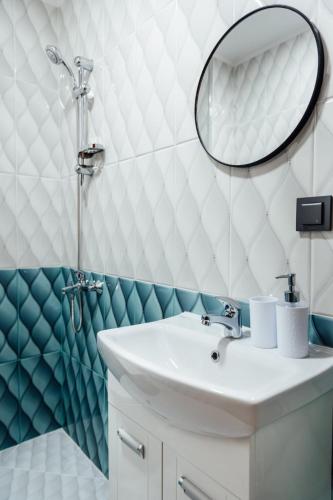 a bathroom with a sink and a mirror at Hrisi&Kris in Sapareva Banya