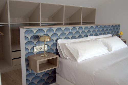 Postel nebo postele na pokoji v ubytování Apartamentos Son do Faro Fisterra