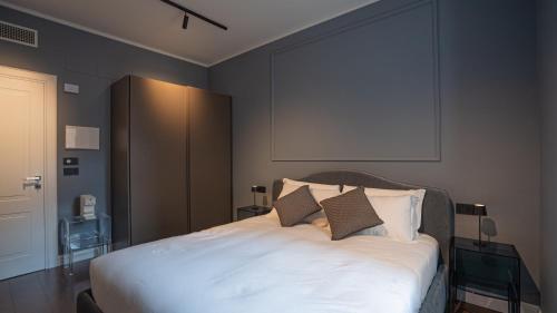 Postel nebo postele na pokoji v ubytování Dimora Vianello Rooms