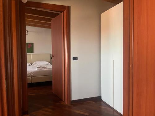 an open door to a bedroom with a bed at Residenza Segrate Centro Segrate in Segrate