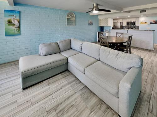 a living room with a couch and a table at Sandy Shores in Port Aransas