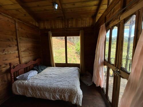 Cama o camas de una habitación en Cabañas la esperancita