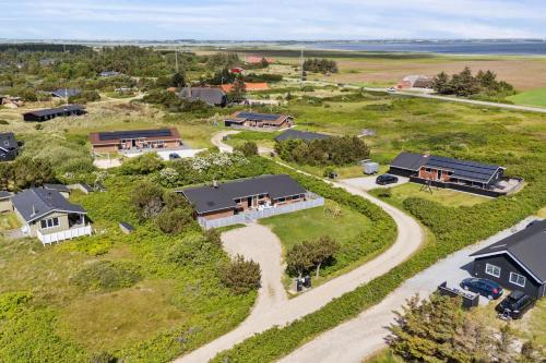 an overhead view of a home with a driveway and houses at Energy-Efficient Pool House Located Between The Sea And The Fjord in Ringkøbing