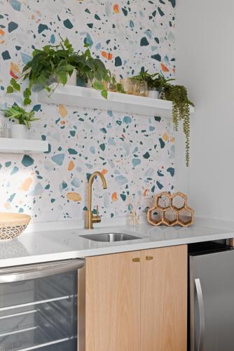 a kitchen with a sink and a floral wallpaper at Coachella -An Atomic Ridge Home in Chattanooga