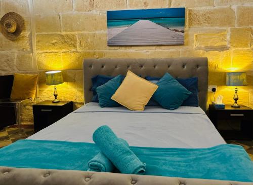 Postel nebo postele na pokoji v ubytování Tal-Bambinu Boutique B&B