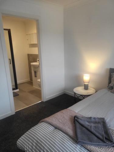 Postel nebo postele na pokoji v ubytování Spacious 4-Bed Home in Beautiful Weymouth