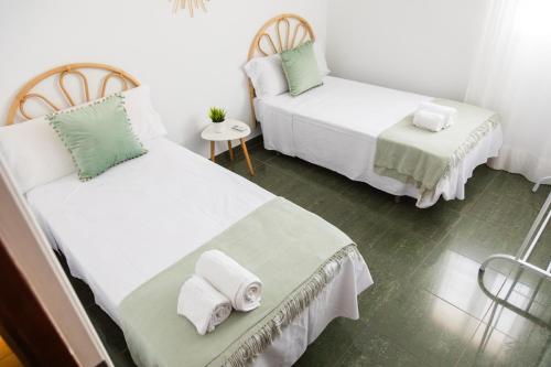 Postel nebo postele na pokoji v ubytování Casa El Abuelo Tomás