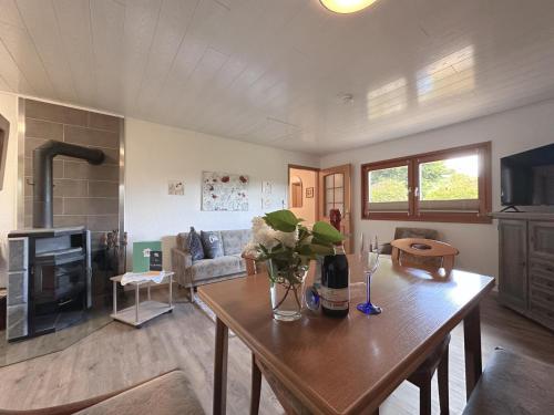 a living room with a table and a couch at Haus Anna in Stadlern