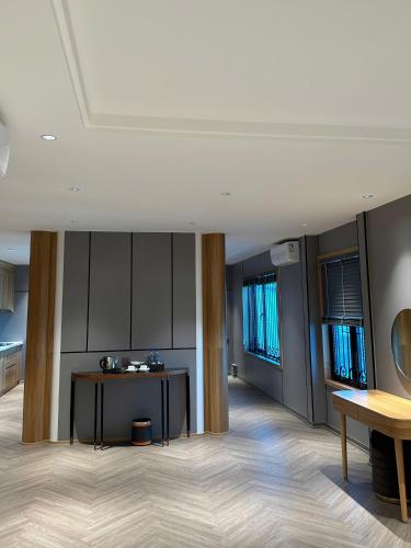 a large room with a table and some windows at New Sun Móng Cái Hotel in Móng Cái