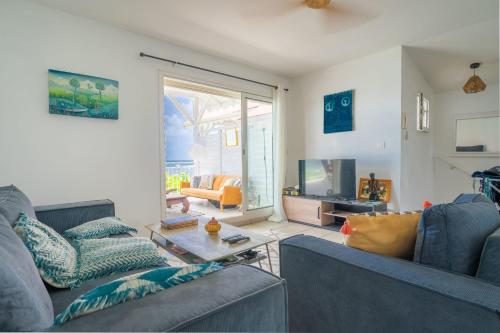 TV a/nebo společenská místnost v ubytování Appartement Côté Plage