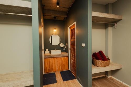 a bathroom with a sink and a mirror at Cosy Pool Villa Khaoyai in Nong Nam Daeng