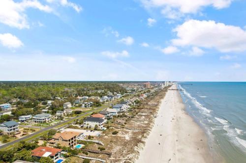 an aerial view of a beach with condos at Stylish Barefoot Golf Condo with Pool Access in North Myrtle Beach
