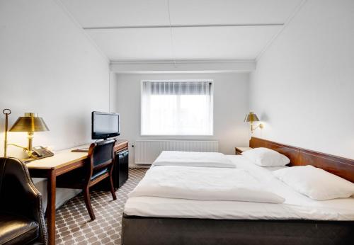 Postel nebo postele na pokoji v ubytování Hotel Kryb I Ly Kro